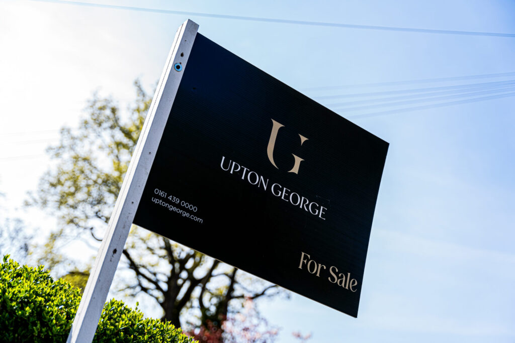 Upton George For Sale board outside a property on a sunny day
