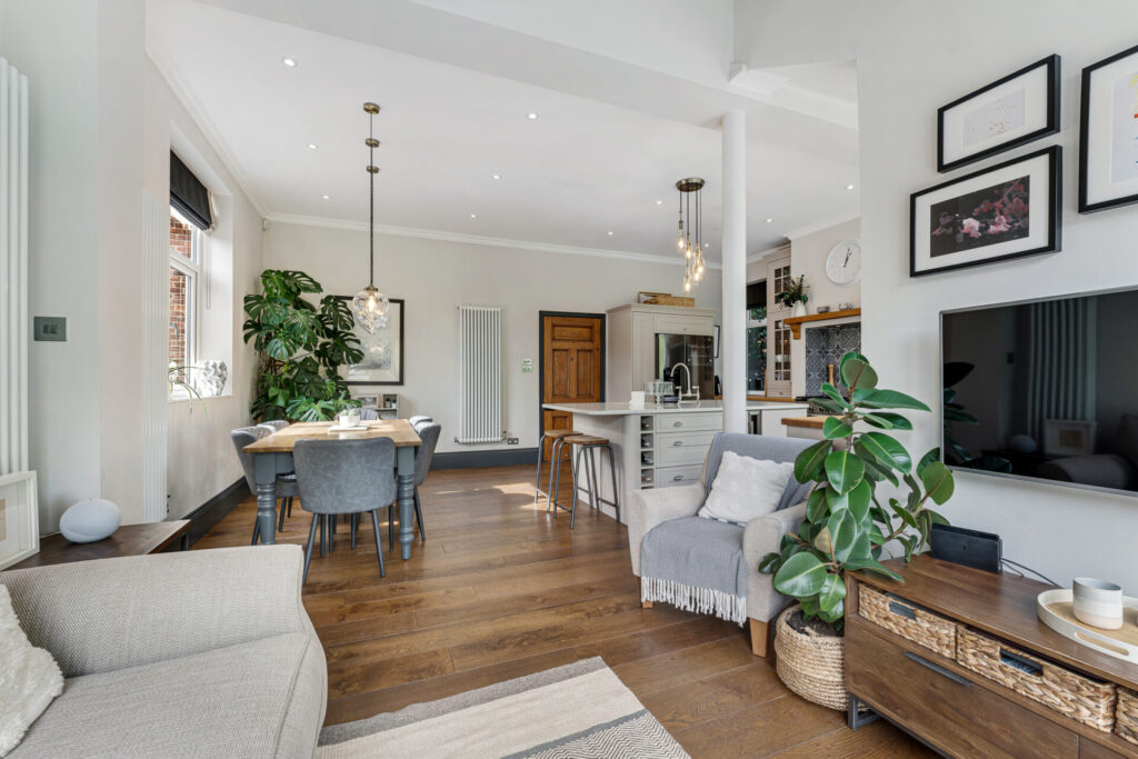 Open plan living and dining space with pendant lights at 184 Bramhall Lane South, Bramhall